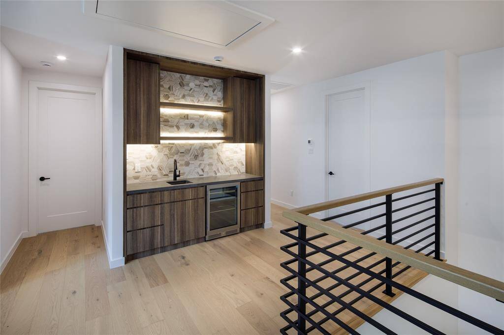 Alternate view of the built in wet bar conveniently located across the game room.  Bonus room is located in the hallway leading to the secondary bedrooms