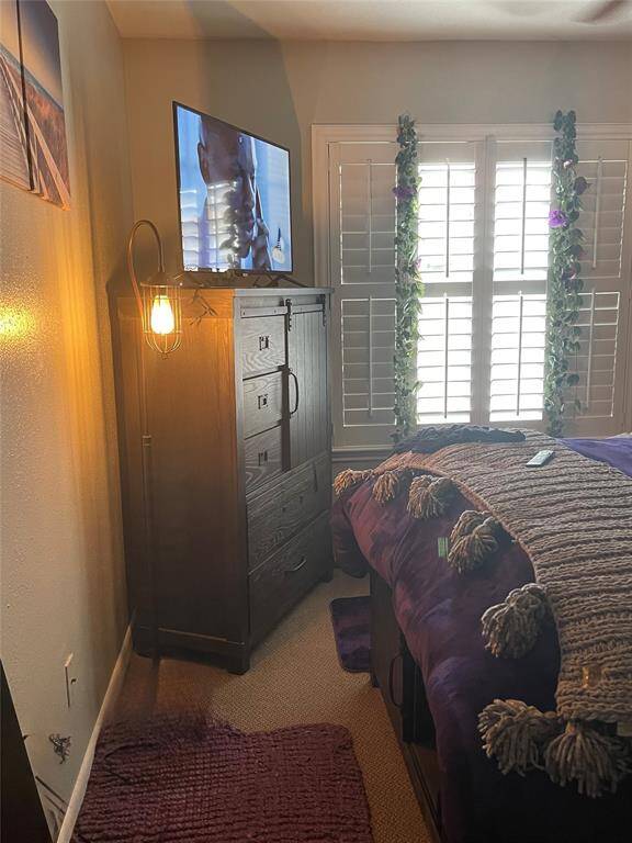 Second view of the bedroom now, window with shutters that provides plenty of natural light creating a comfortable and inviting atmosphere.