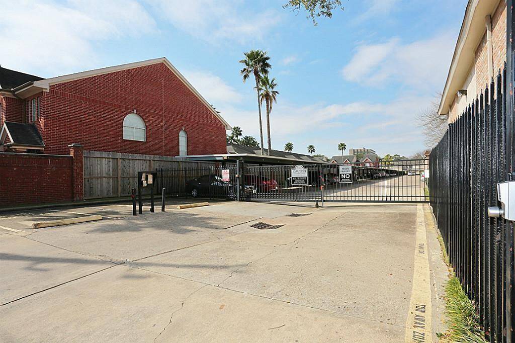 Gated community with covered parking spaces.