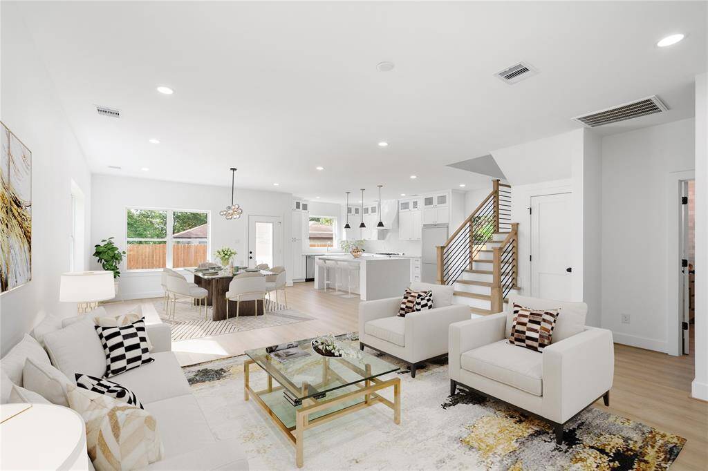 Virtually stages photo of the living and dining space