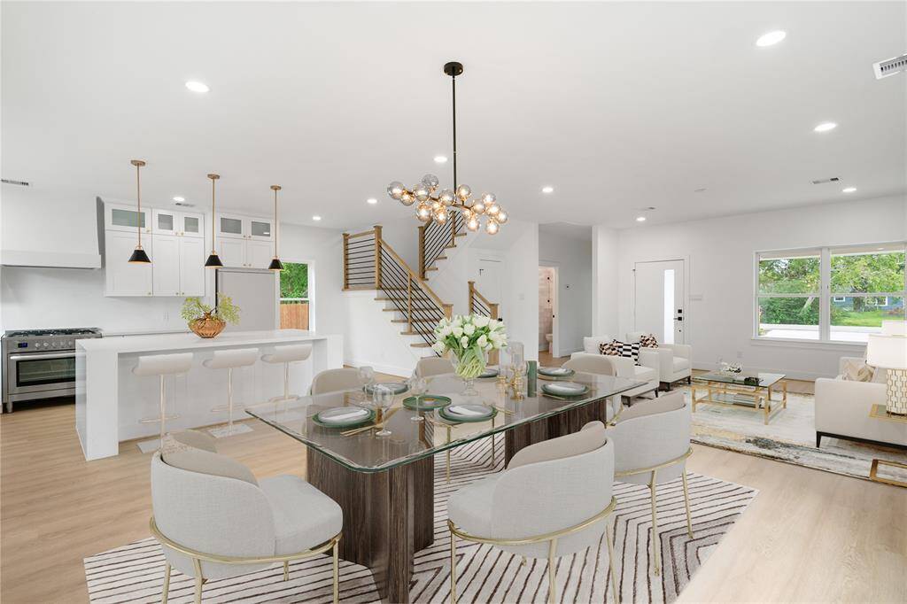 Virtually staged photo of the dining and living area