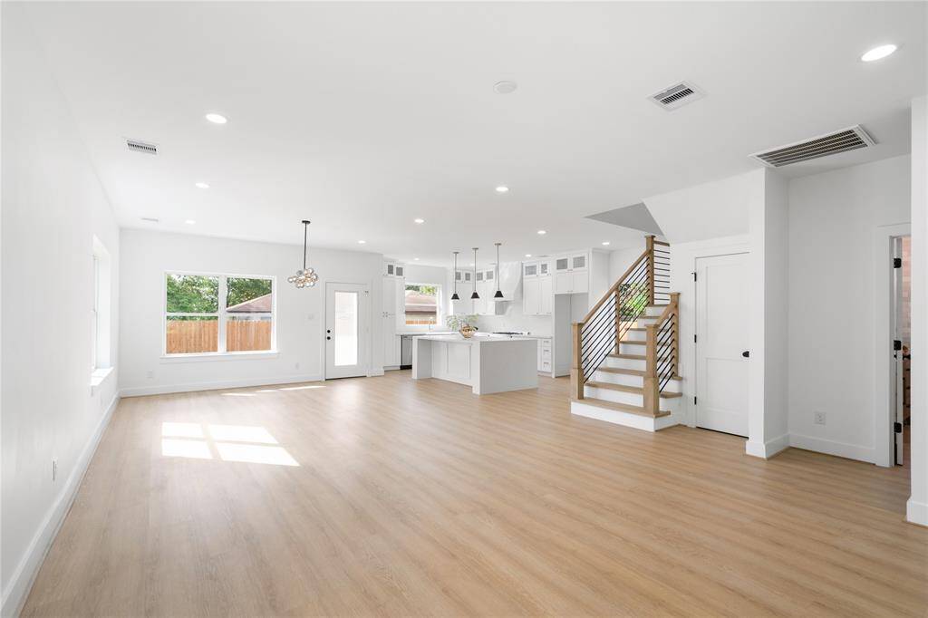 As you walk through the front door, you are greeted by wide open spaces