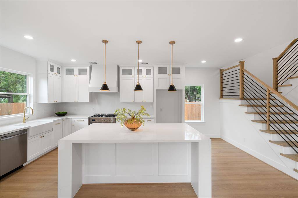 Quartz Counter Tops and island showcasing the waterfall edge