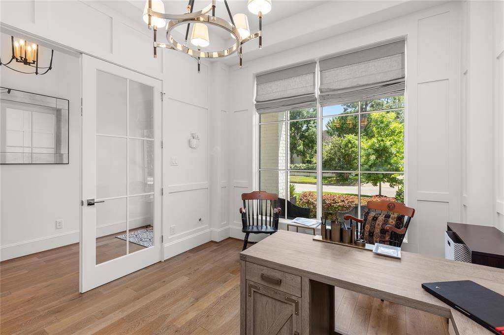 Glass french doors, 6-light chandelier, pull down shades.