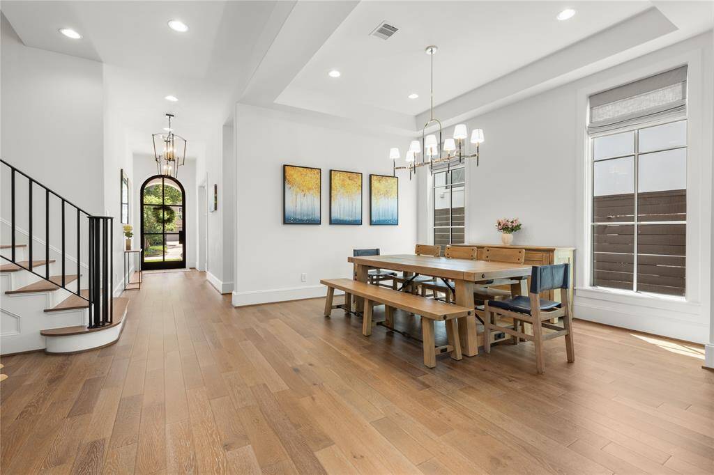 Iron stair rails & balusters, recessed lighting as well as gorgeous light fixtures throughout