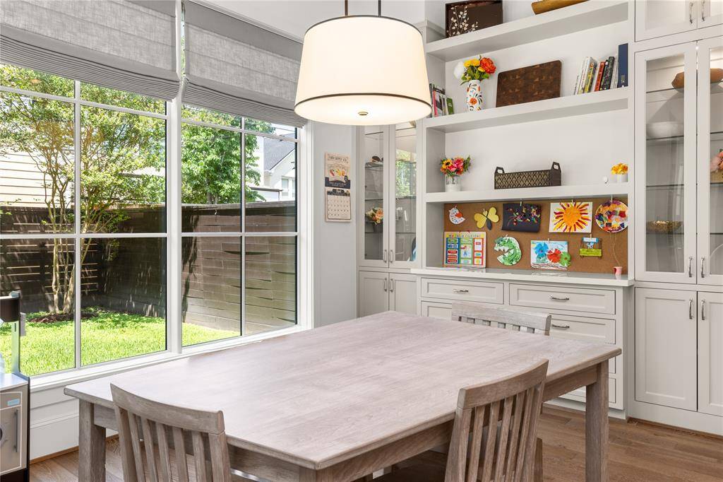 Custom cabinetry w/ glass doors and interior lighting.