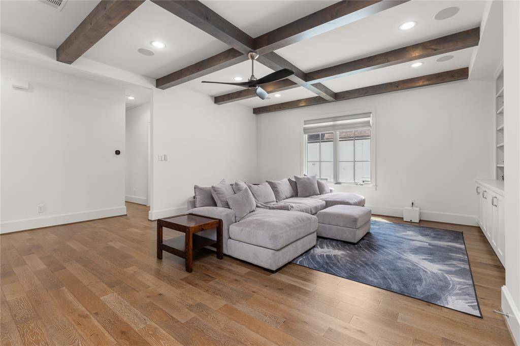 Wood beam accents, spacious & versatile game room