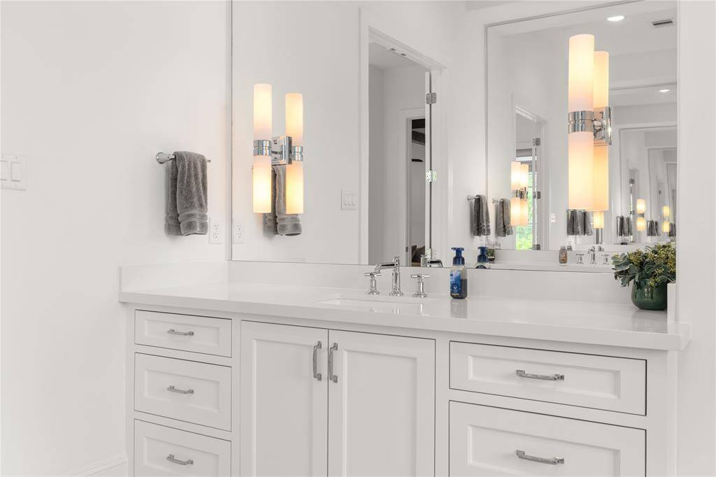 Another vanity in the primary bath with plenty of counter space & storage.