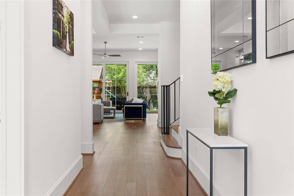 Formal entry, 8" baseboards, Engineered European White Oak 5" plank floors.