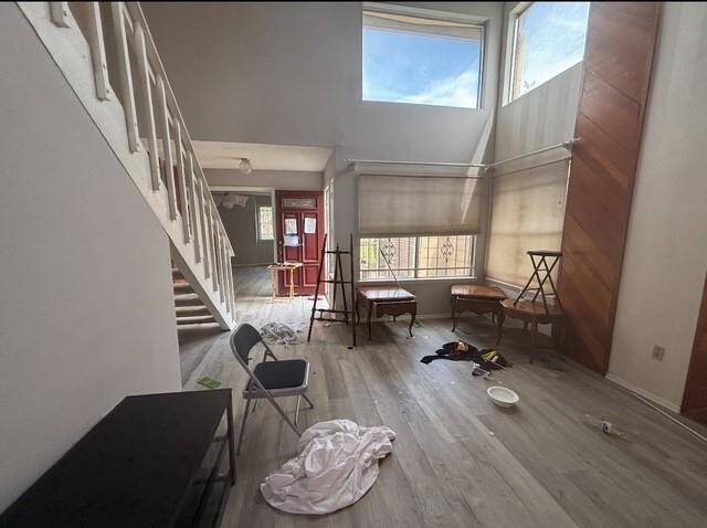 There are many ways to furnish this grand den that is flooded with natural lighting.