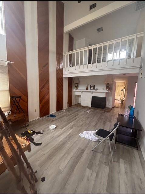The opposite view of the grand den with the loft study above