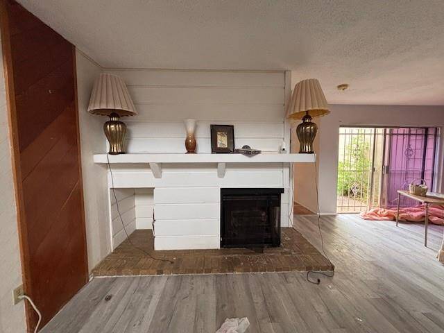 Take note of your corner fireplace and inset firewood storage area. The mantle offers decorative possibilities.