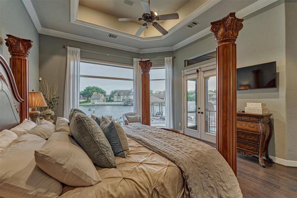 Double doors lead to a private screened porch.