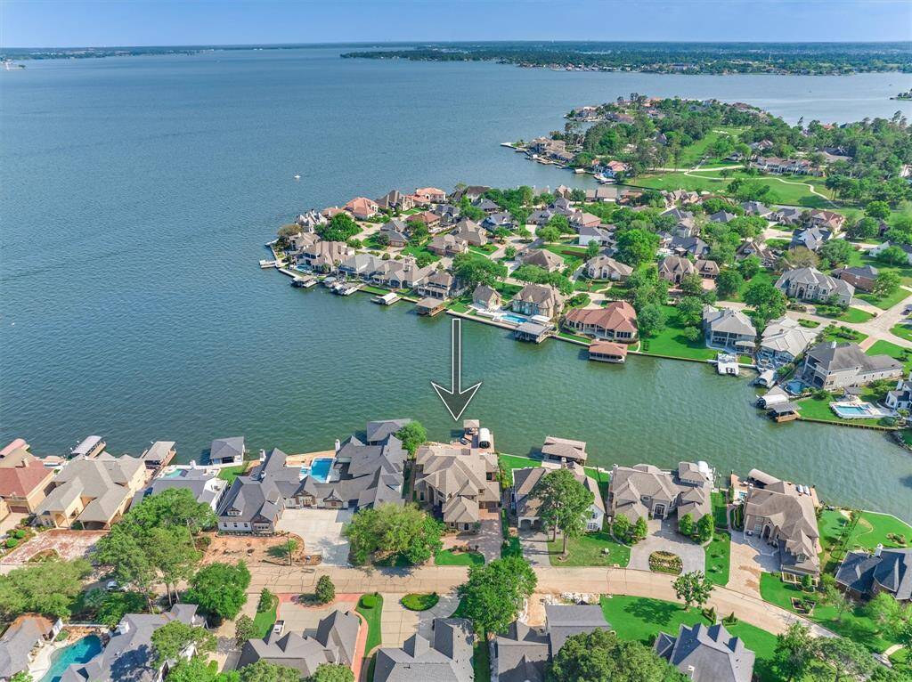This home is ideally situated on a wide, open cove of Lake Conroe, offering stunning water views and easy lake access.