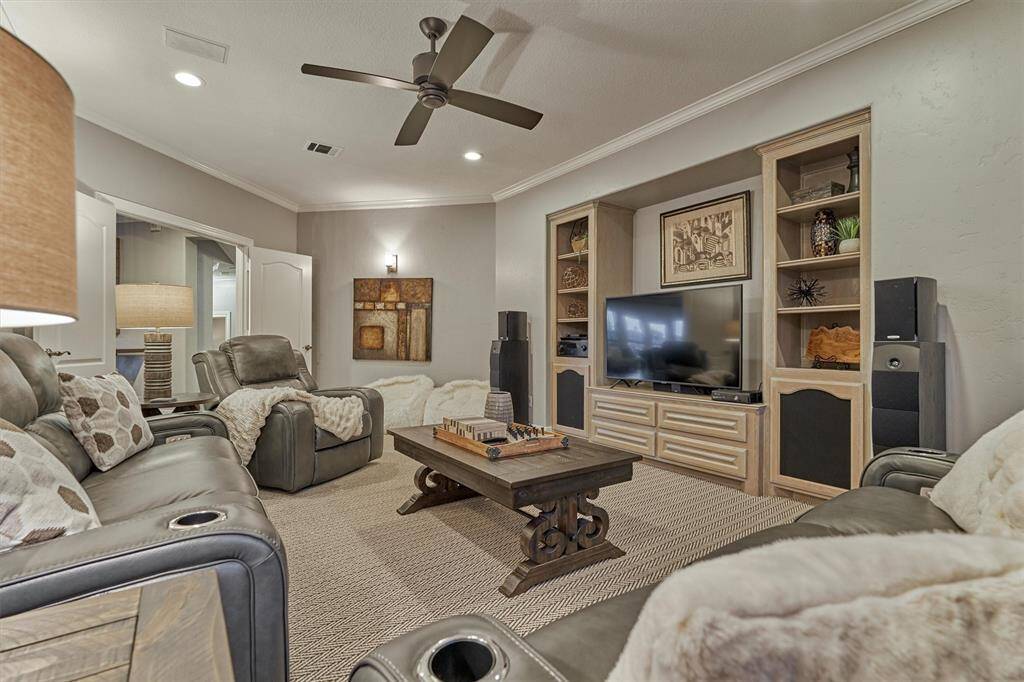 Enjoy movie nights or game days in the media room, complete with built-ins for audio/visual equipment and surround sound. This cozy, well-equipped space is designed for the ultimate at-home entertainment experience.