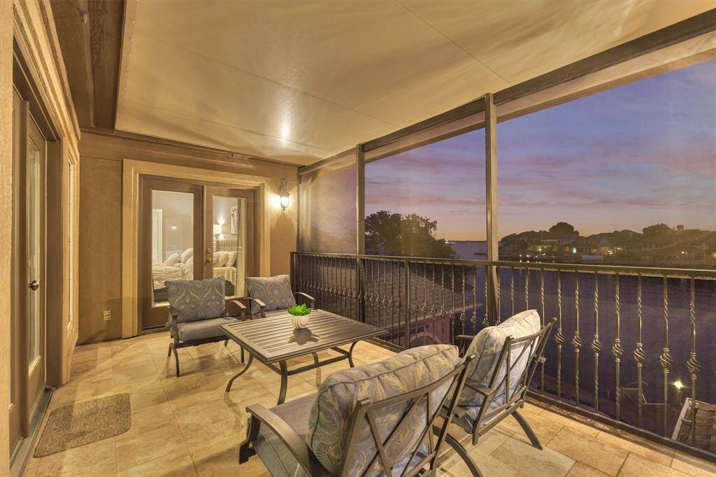 The second floor screened in balcony offers 180 degree views of the lake and can be enjoyed year-round.