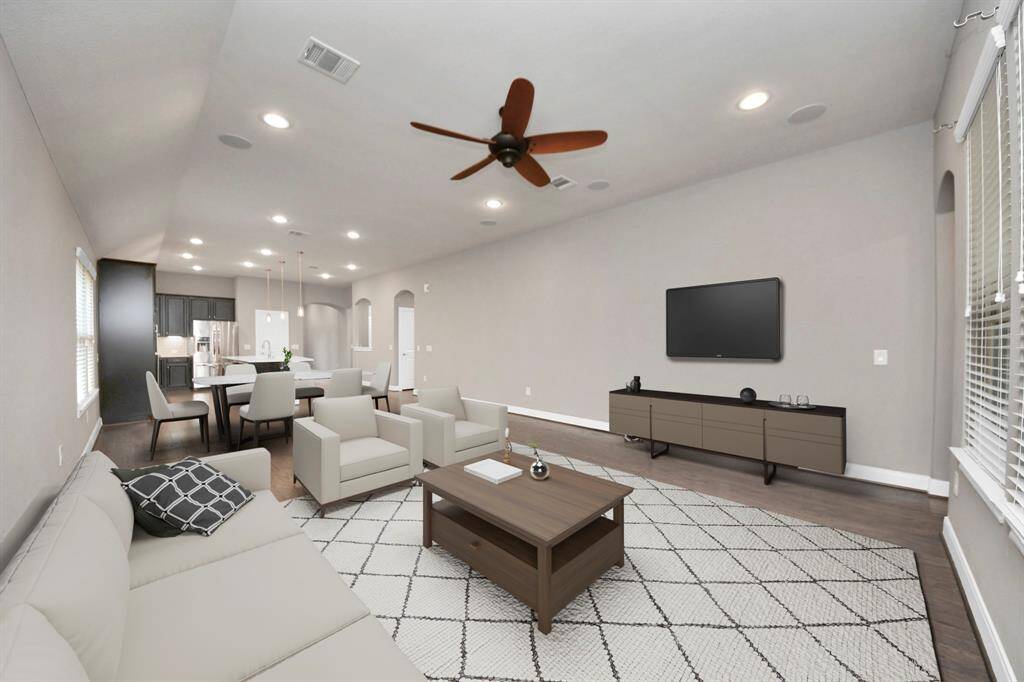 Here, virtually staged, you can envision how the space could look, filled with inviting furniture and décor that enhance its warmth and comfort.