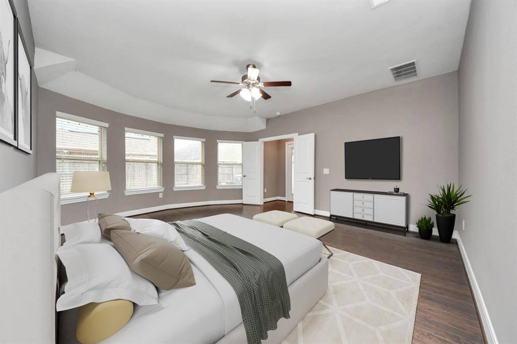 The primary suite offers a peaceful retreat and features beautiful bay windows that bathe the room in natural light. This space has been virtually staged to help you envision its full potential.