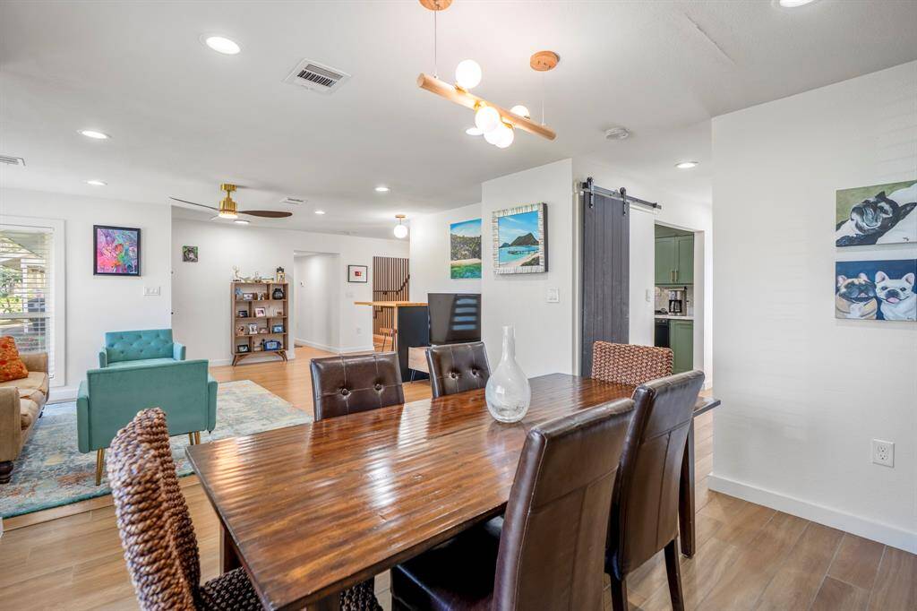 This is where you will have wonderful conversations and dinner with your friends and family. Barn door is the pantry. The kitchen is accessible by both hallways.