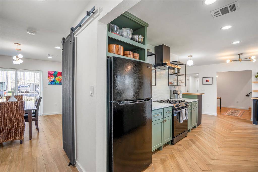 The flow from the dining room to this adorable kitchen.