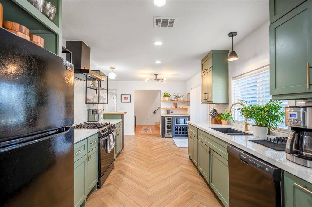 Welcome to your incredible galley kitchen with plenty of storage and stunning herringbone wood floors.