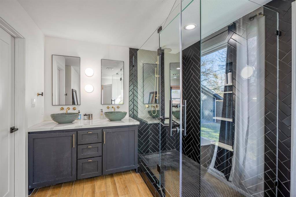 Dual vanities with plenty of storage. Door to the left is your walk-in closet.