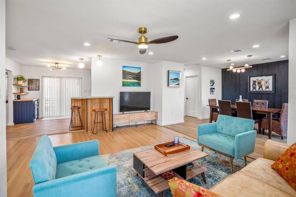 Another look at this light and bright space in relation to the rest of the home. The closed door in this picture is the utility room.