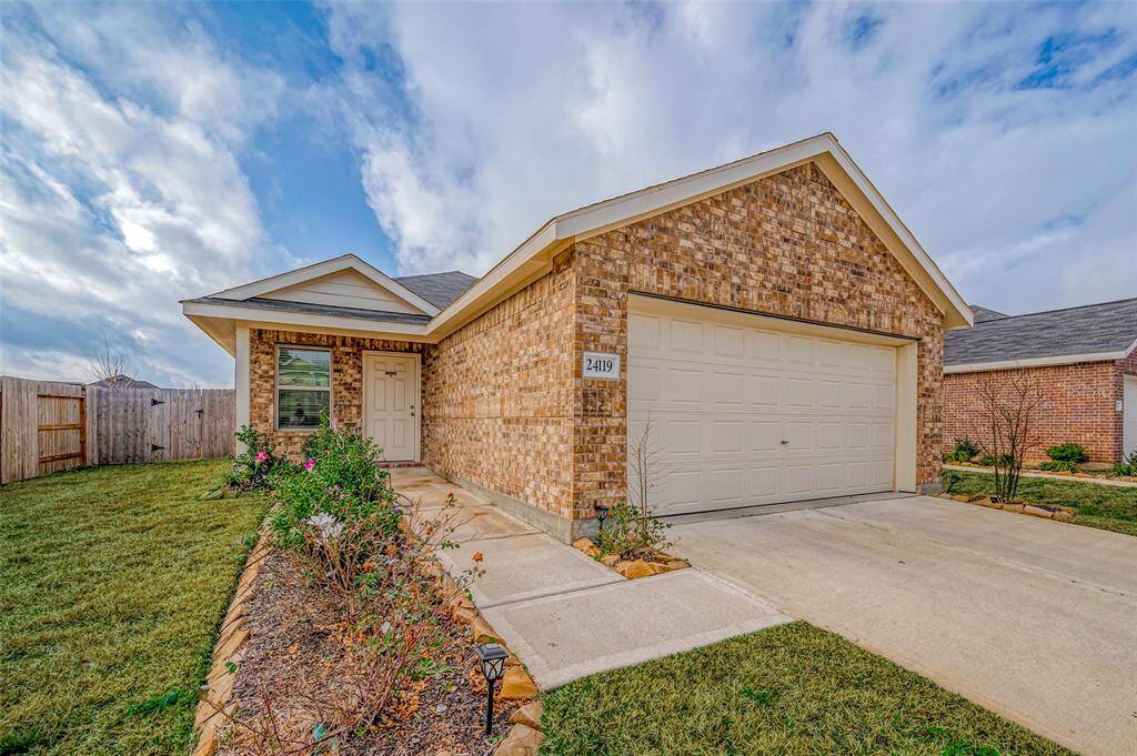 The entrance to the home, subtly tucked to the side, provides a sense of privacy while maintaining an open and approachable feel.