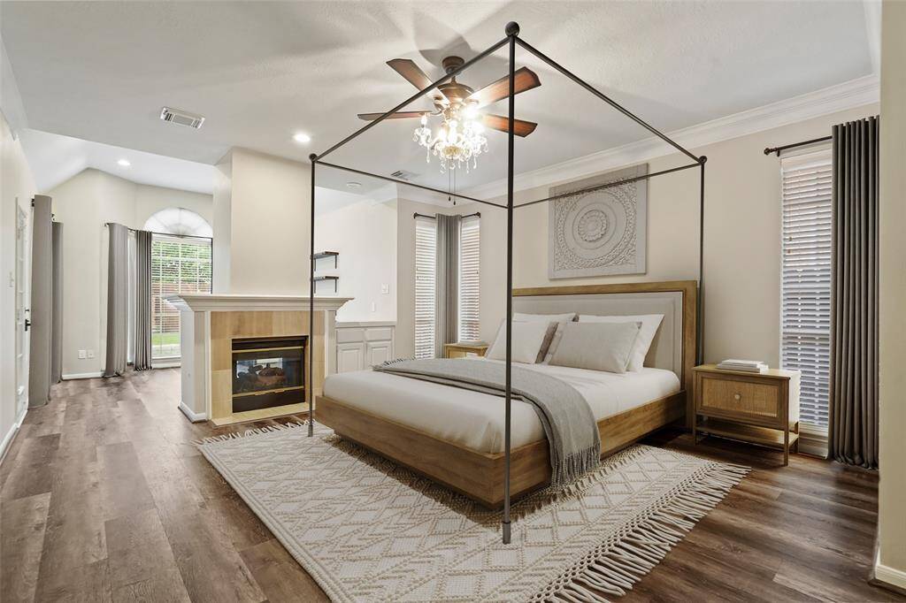 A virtually staged master to give you an idea of how large this room is! The fireplace makes this space so cozy!