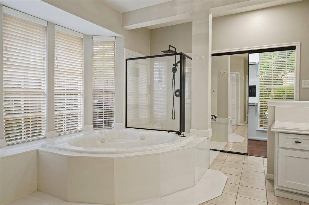 You also have an amazing jetted tub and separate glass shower with his and her closets!