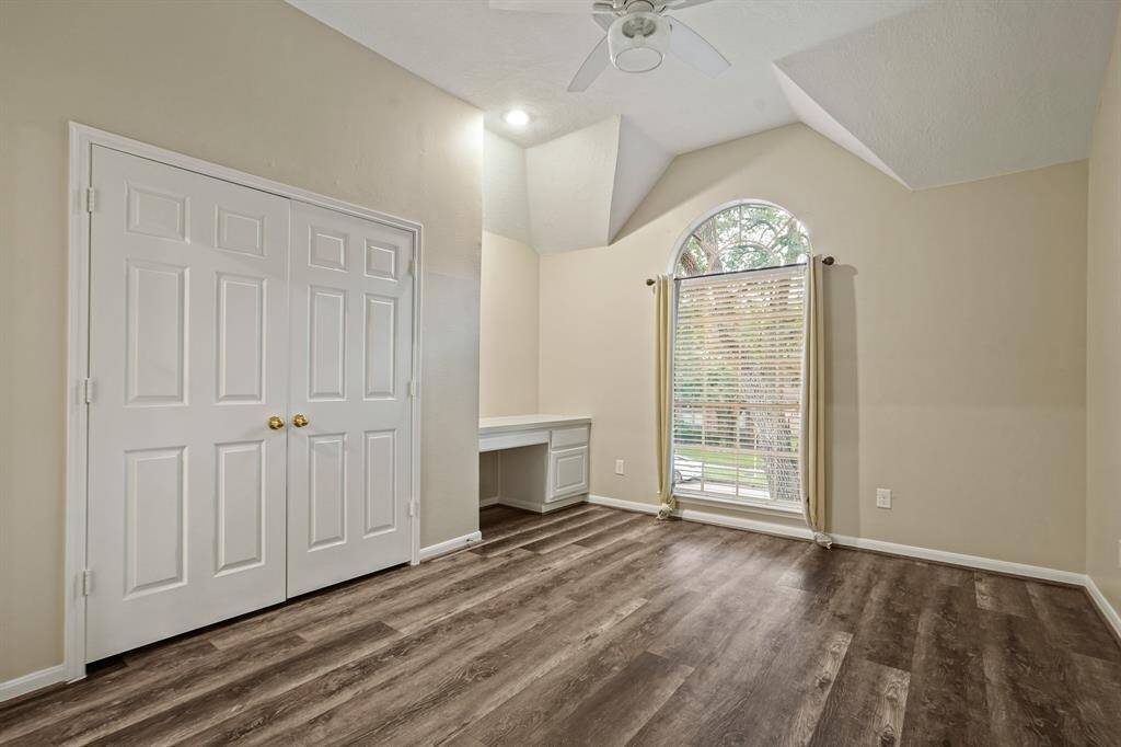 Secondary bedroom includes a large closet and a desk space. Attached to a Jack and Jill bath, all of these rooms have beautiful windows for natural light.