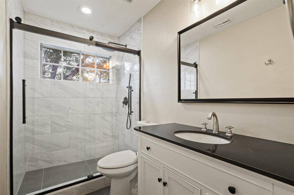 This secondary bath was completely renovated in 2023
