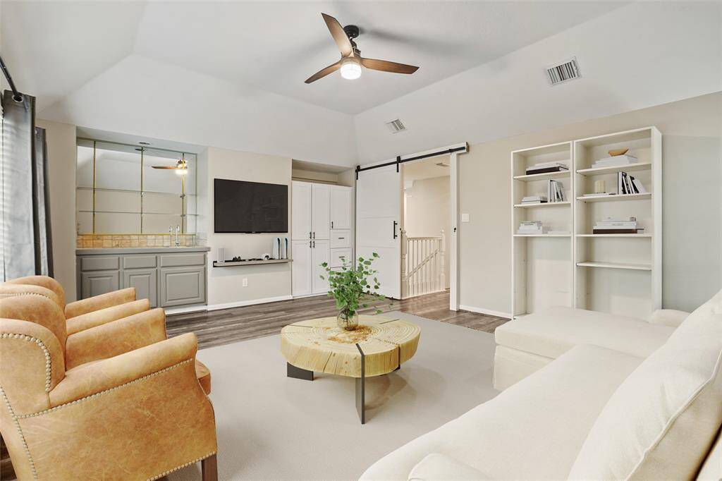 A virtually staged game/media room! Such a wonderful way to set up this space for friends and family to hang out together playing games or watching movies!
