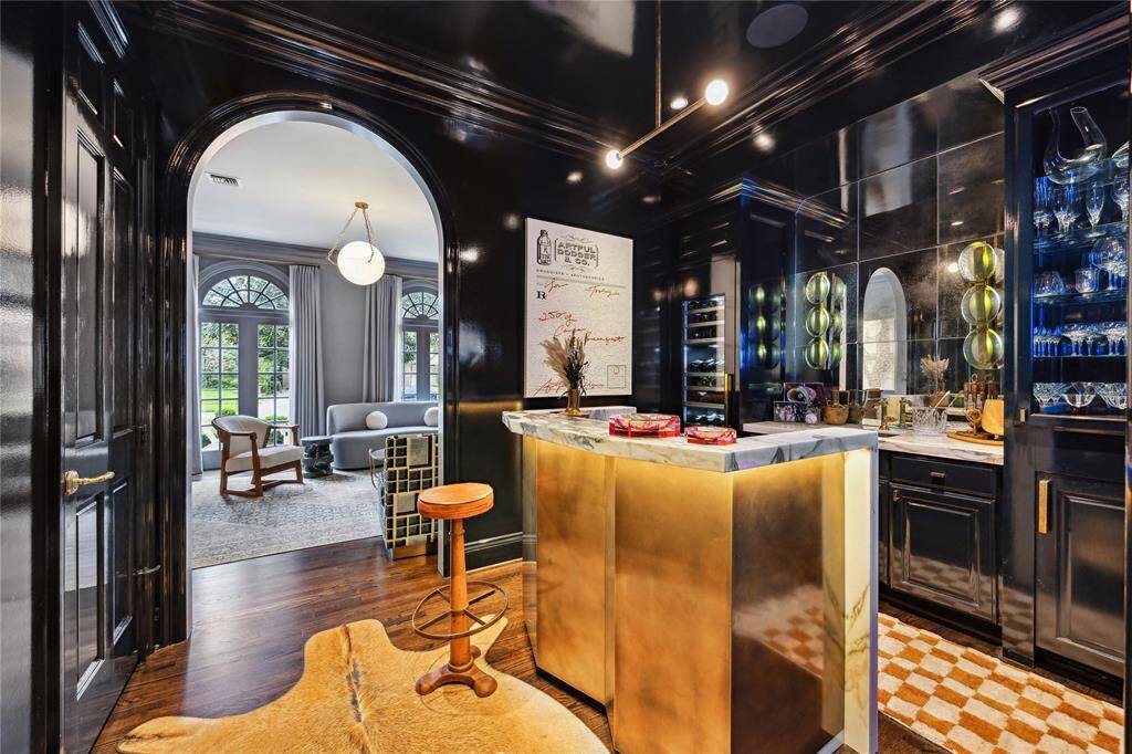 The Entertainment Bar has a brass bar custom-designed by Dillon Kyle Architects and James Dawson with a Calcutta Monet marble counter top