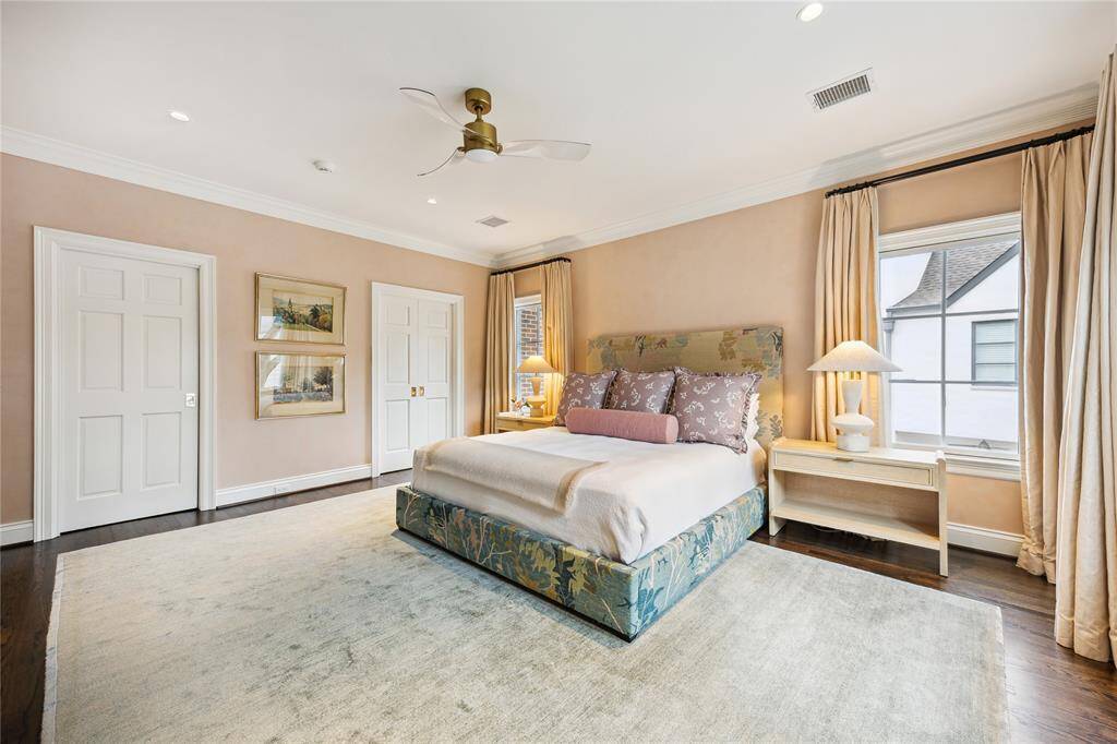 This elegant Primary Bedroom features double doors concealing a hidden Wet Bar and private Office Space.