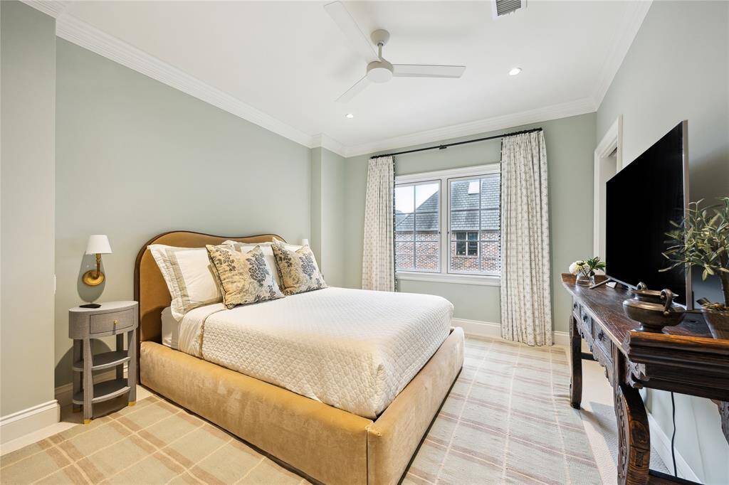 The custom drapery in the Secondary Bedroom utilizes Erika M. Powell Textiles’ Petite Cross + Dot fabric and a Schumacher trim.