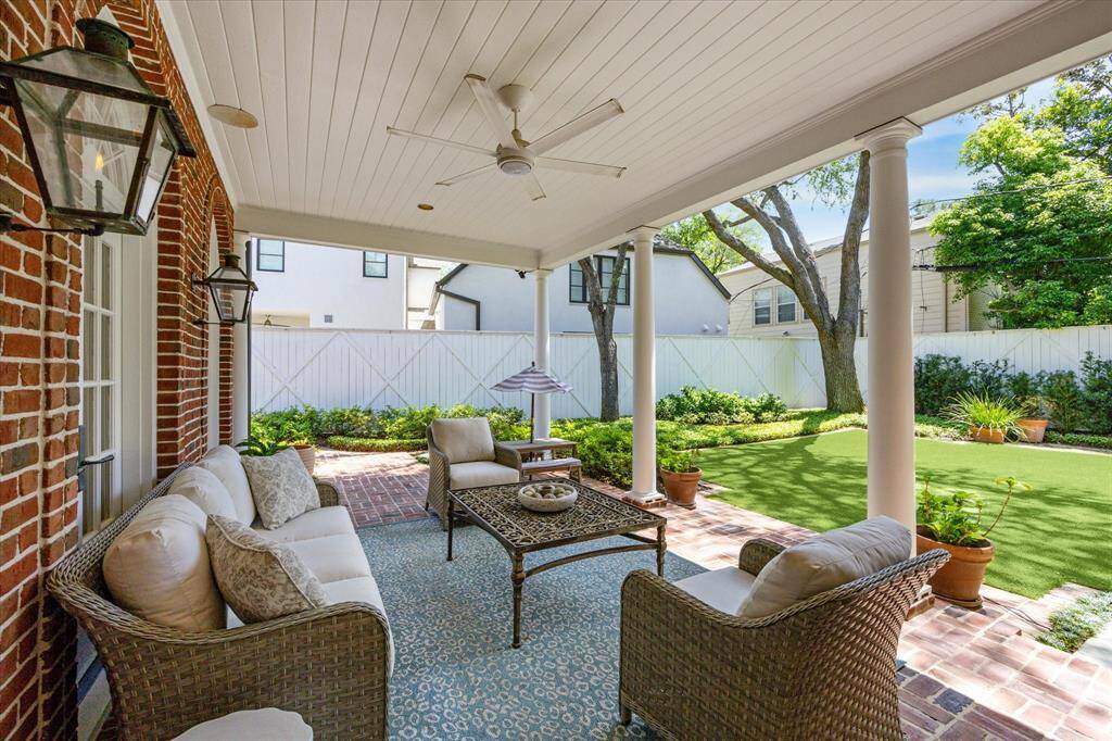 This backyard is complete with a roomy covered porch. Perfect way to enjoy the outdoors while staying cool!