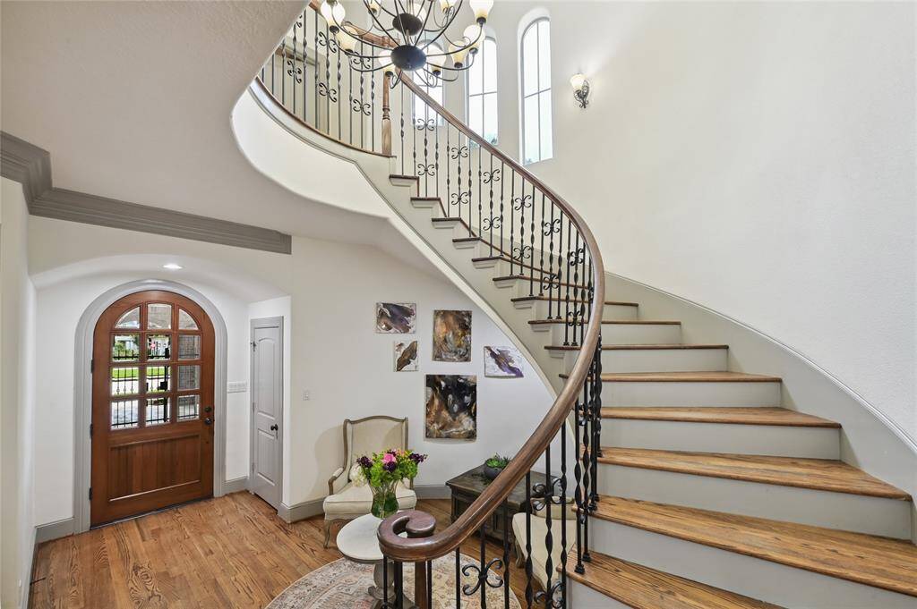 Cascading staircase leads into the second-floor living!