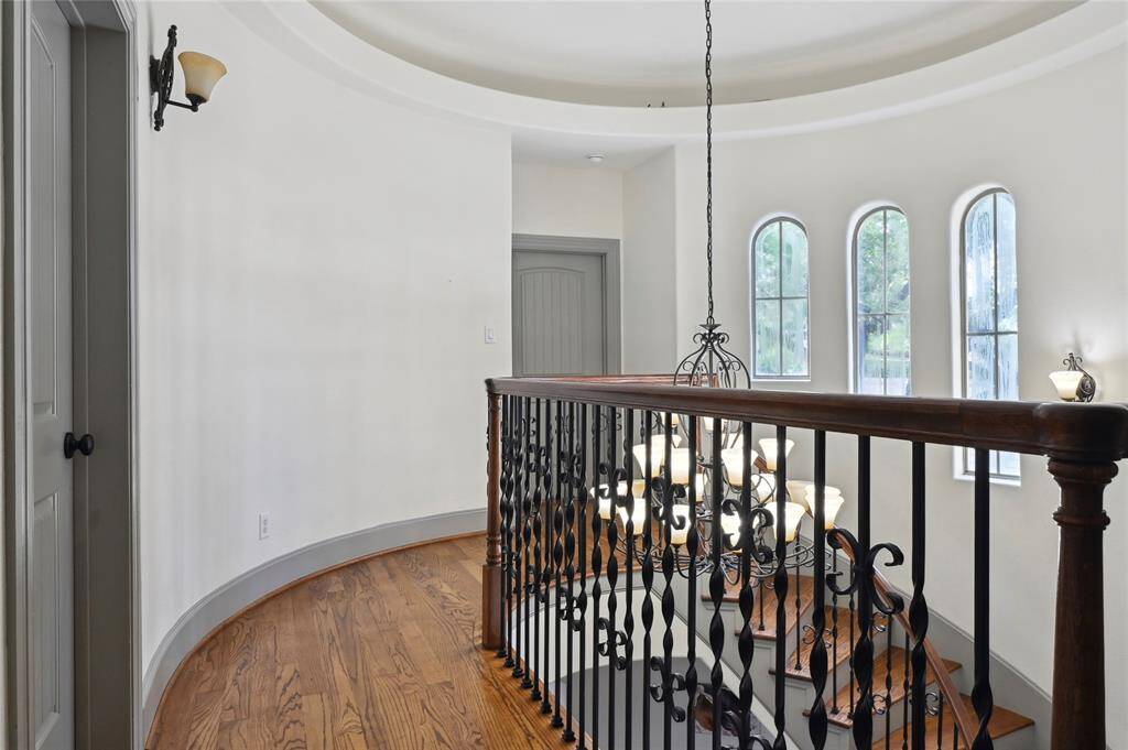 Elegant upstairs hallway leads to the other bedrooms!