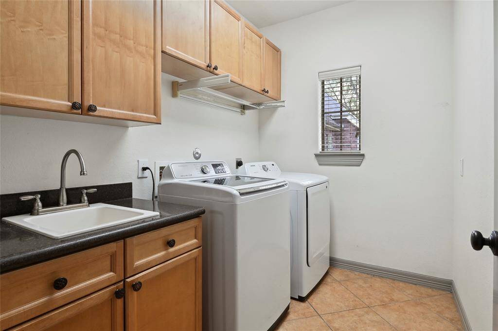 Private laundry room with wet bar located upstairs between bedrooms!