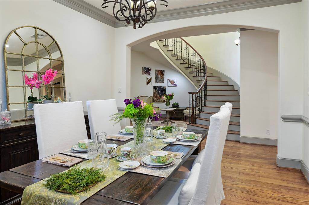 Elegant dining room overlooks the cascading staircase and foyer!