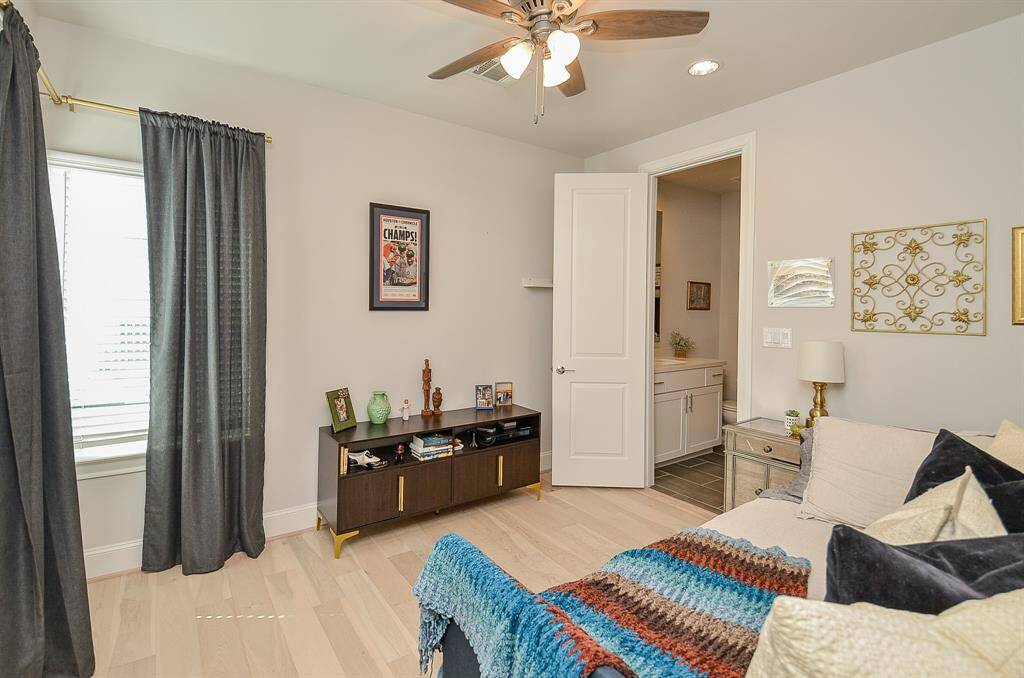 Secondary bedroom on the 3rd floor with en-suite bathroom and large windows bringing in natural liight.