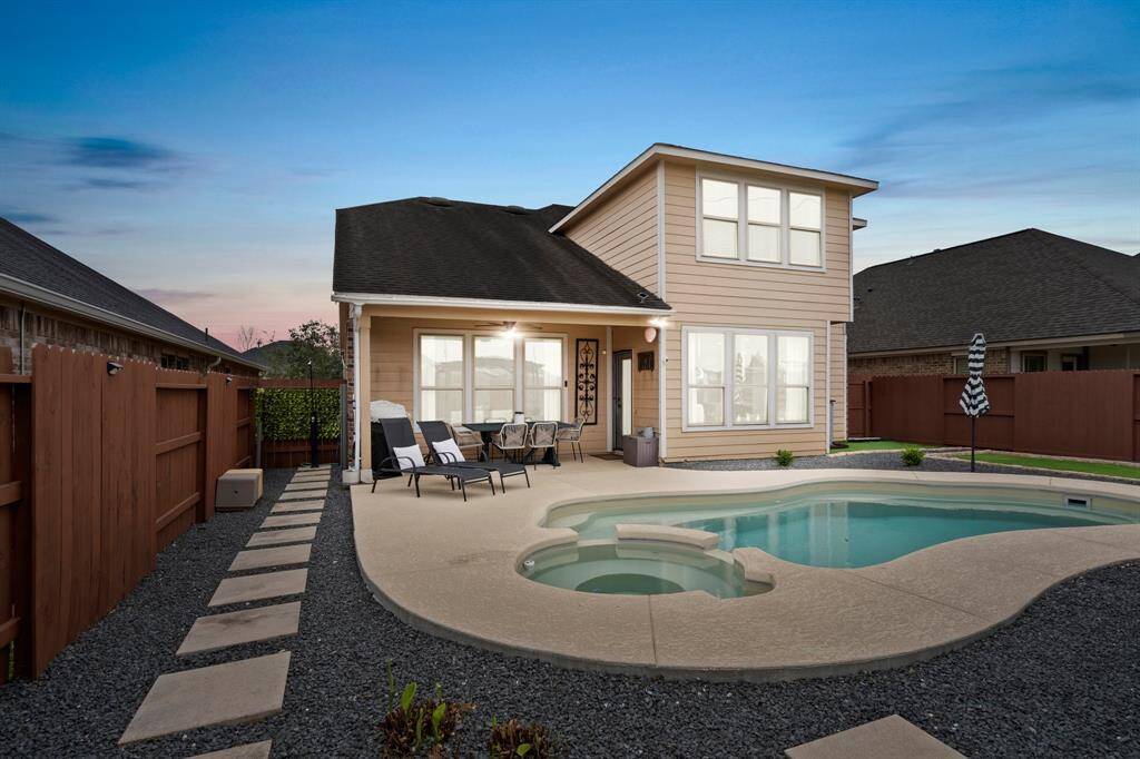 Step into the backyard oasis, with alarge covered patio overlooking the pool and spa, creating aninviting outdoor retreat.
