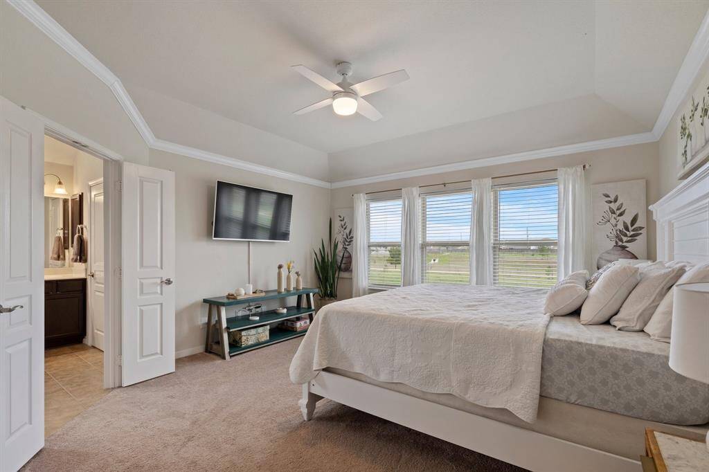 Step into the sanctuary of theprimary bedroom.