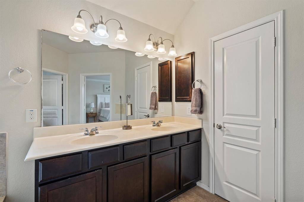 The primary bathroom also has dual sinks.