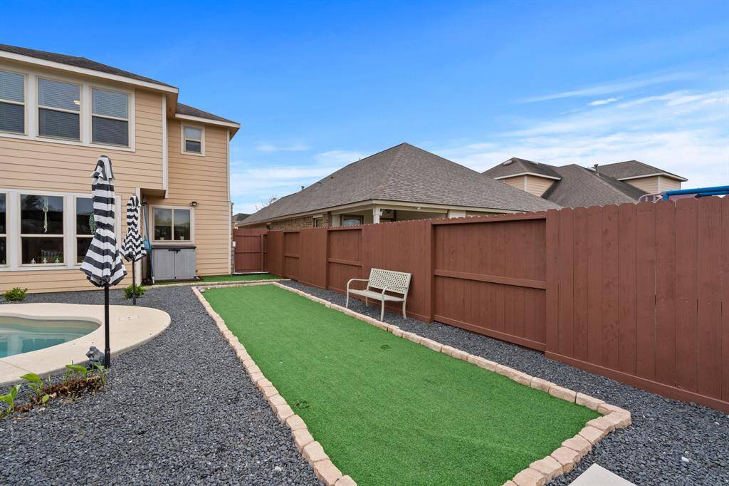 The backyard has turf perfect for golf practice.