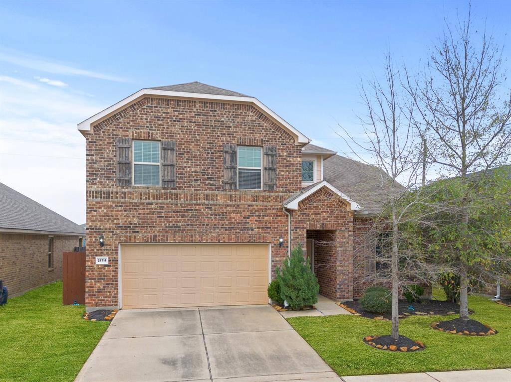 Approaching the front door you will see the beautiful brick elevation, covered front porch, and lovely landscaping.
