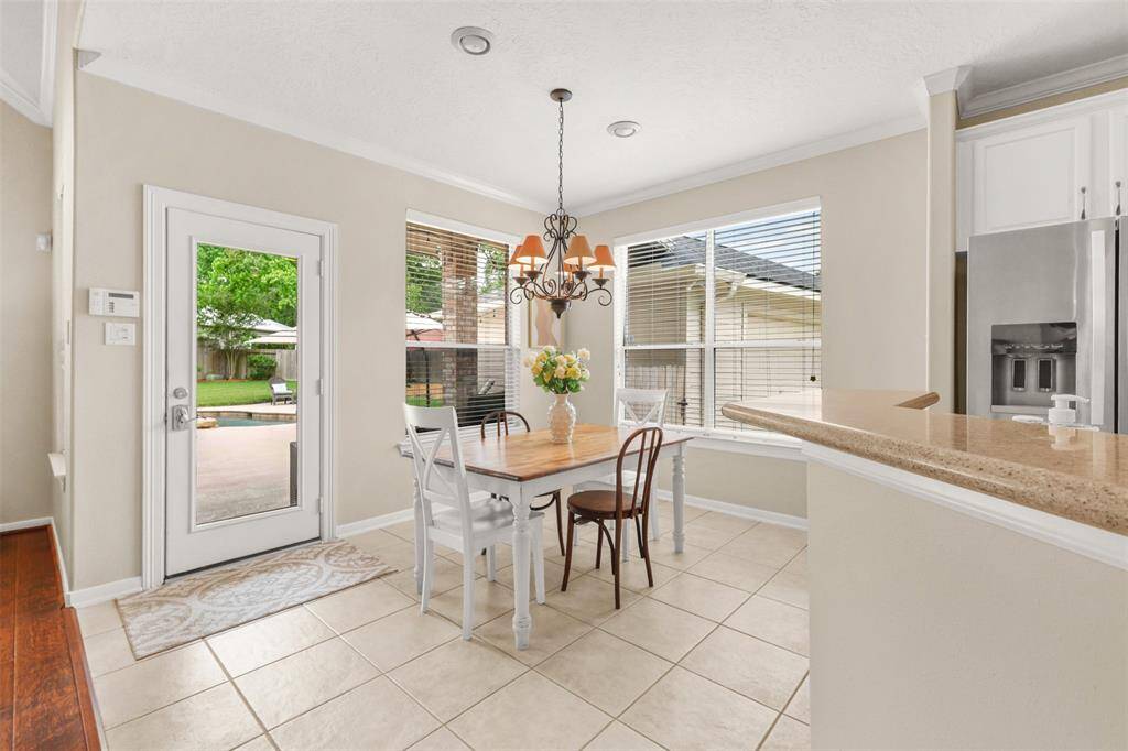 Breakfast room offers views of the patio and pool area.
