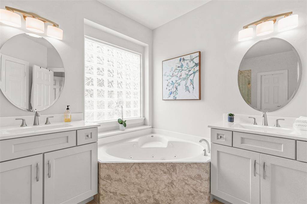 Jetted tub offers relaxation in this thoughtfully designed retreat.