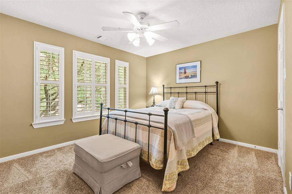 Secondary bedroom with plantation shutters and plenty of light.